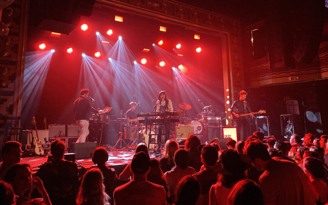 Image of rock band Deep Sea Diver playing onstage with female lead vocalist