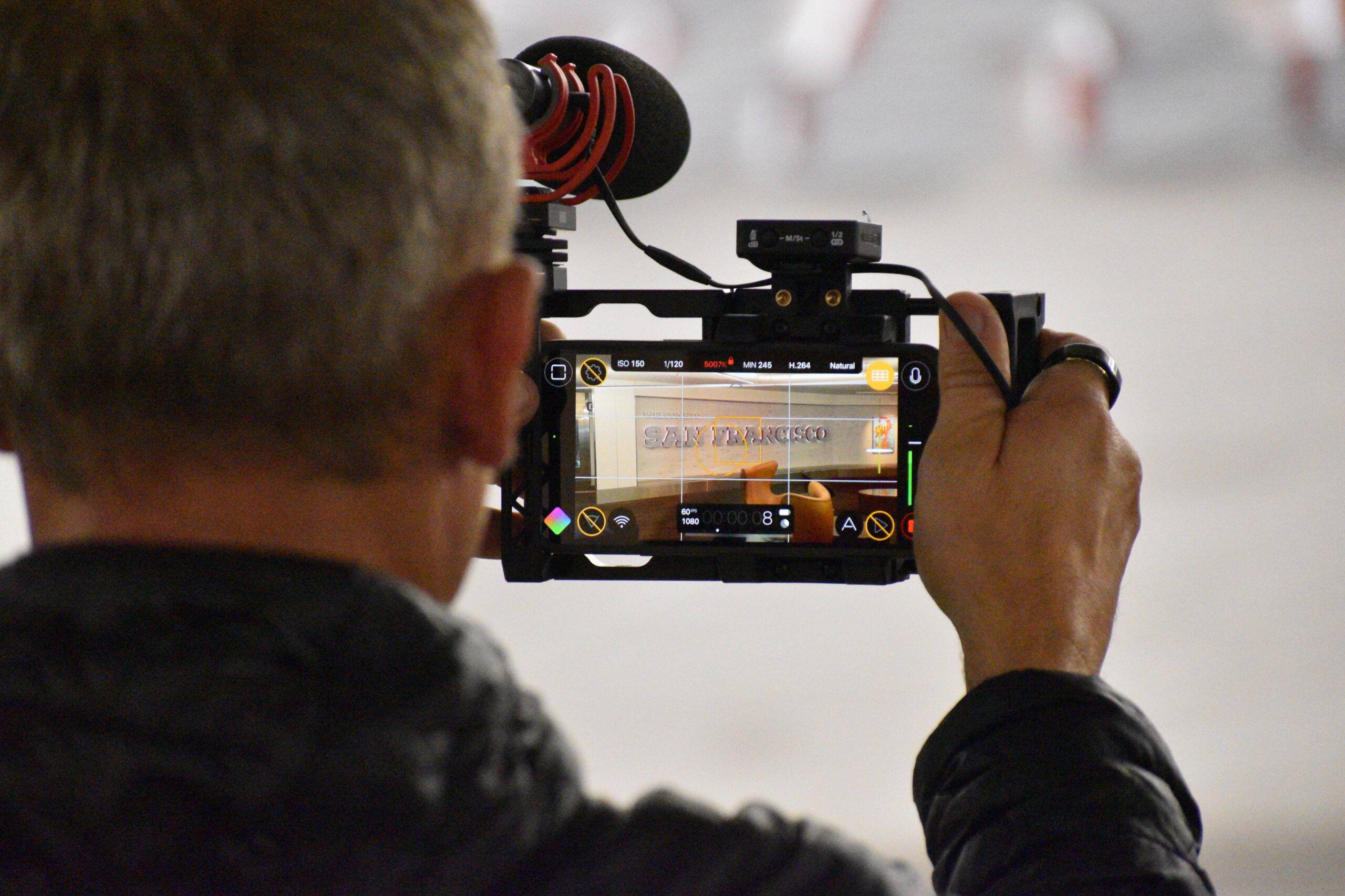 Stifter (left) shooting b-roll segments at San Francisco International Airport