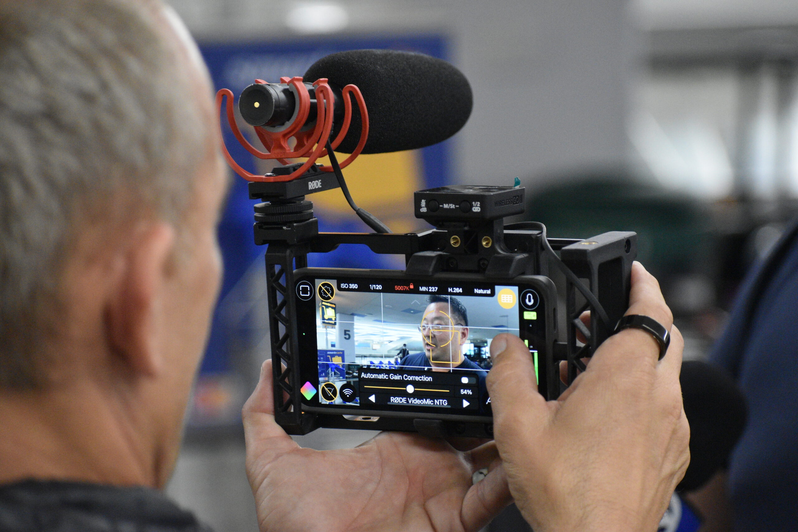 Photojournalist Stefan Stifter (left) recording an interview with a stranded United Airlines passenger with Filmic Pro v7 for the KGO-TV ABC7 morning news segment.